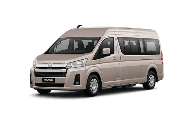 Toyota Hiace Premio Luxury coklat muda metallic tampak serong depan dan samping untuk layanan sewa Hiace Luxury Bandung dengan driver profesional